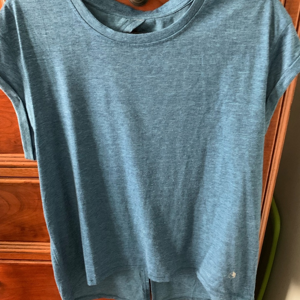 Workout top with cutout in back on top and slit in back at bottom
